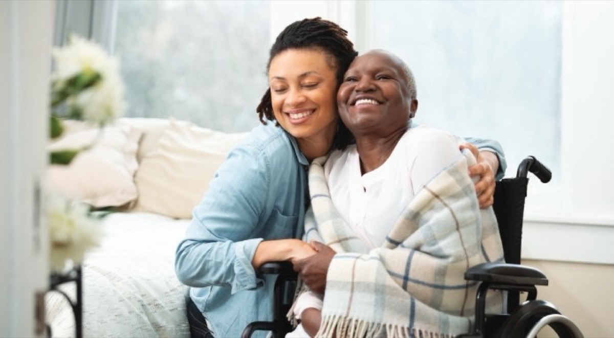 A certified caregiver supporting an elder with compassionate care