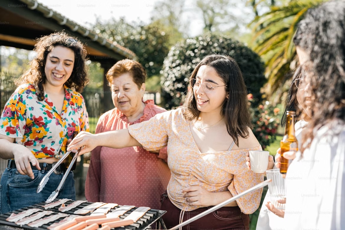 A local cook grilling food for neighbors in a community setting
