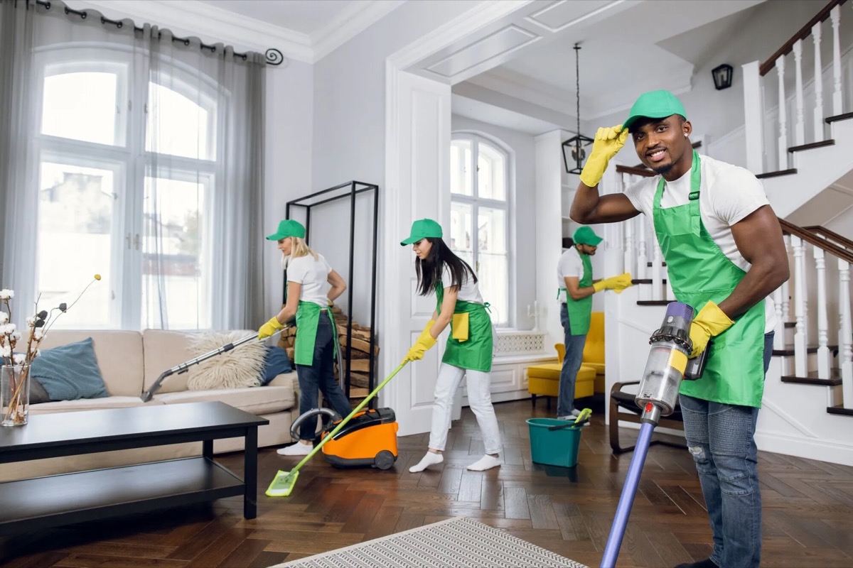 A local helper cleaning and fixing items inside a home
